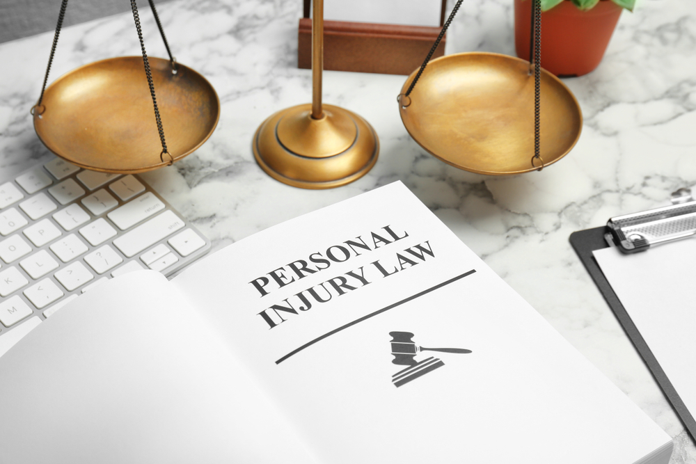 personal injury law and scales of justice on table